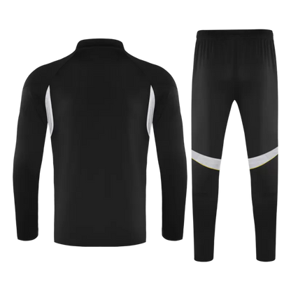 Tuta Real Madrid con zip 1/4 (giacca+pantaloni) 2025/26 - Nera